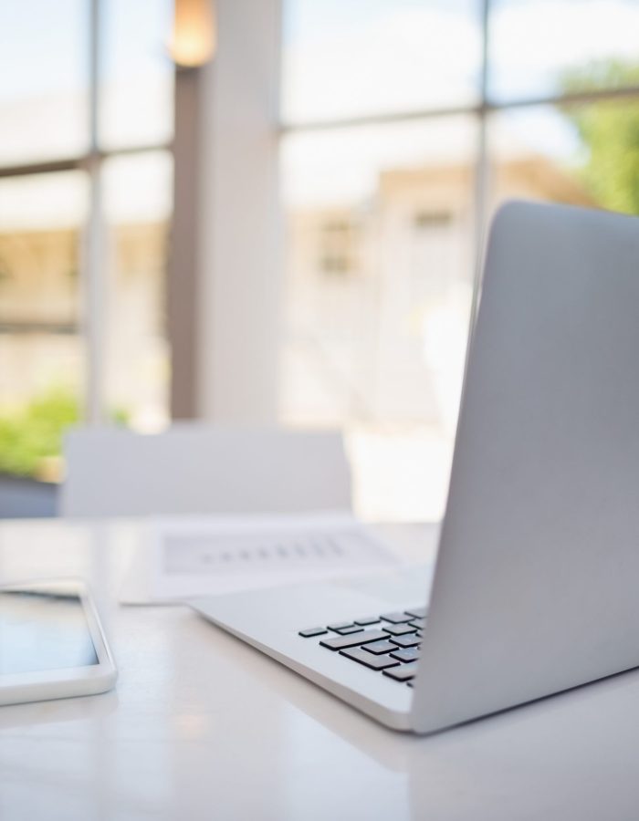 Laptop and digital tablet on table